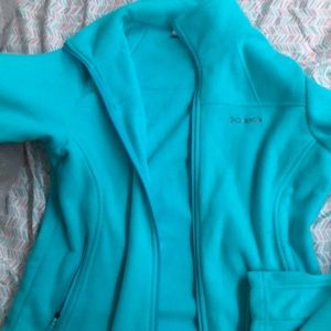 Turquoise Columbia fleece jacket size,with utility phone size pockets on sleeve.